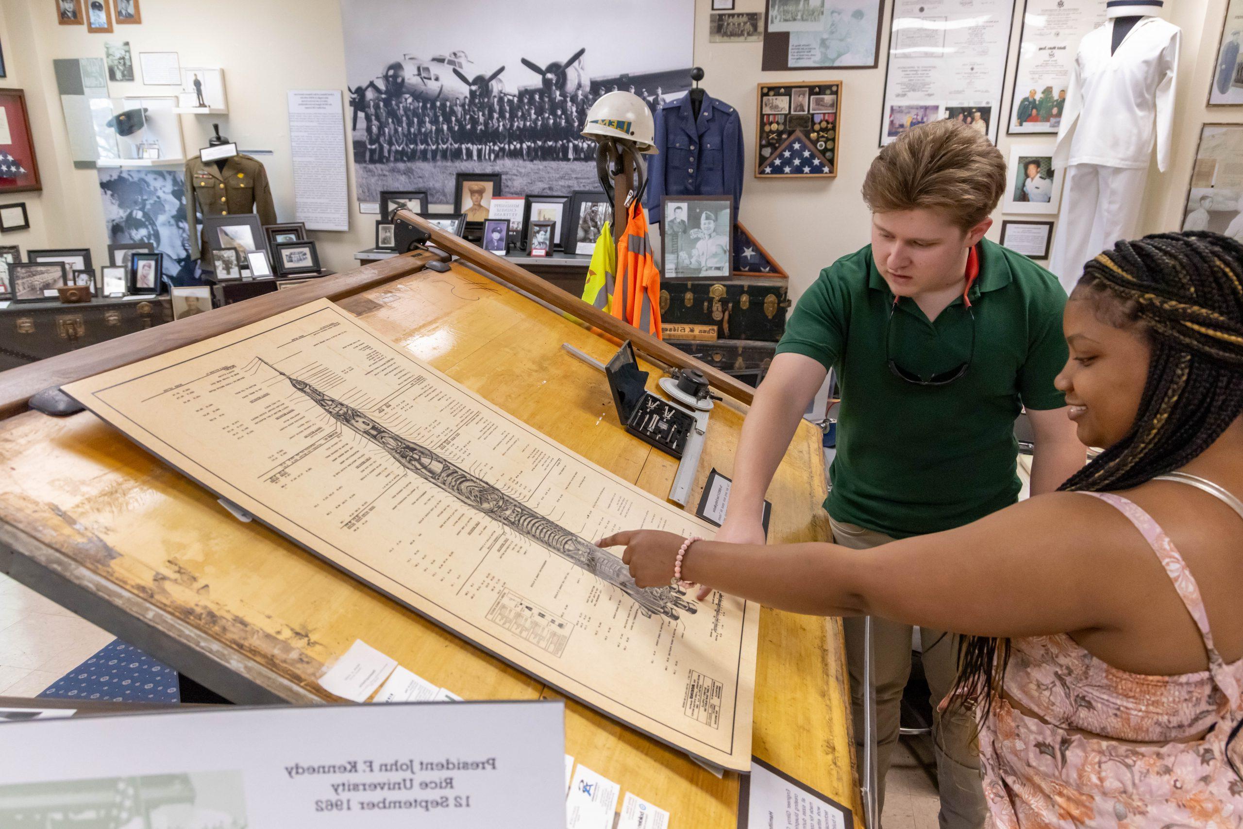 Two students looking at history artifacts in the Capps Archives and Museum.